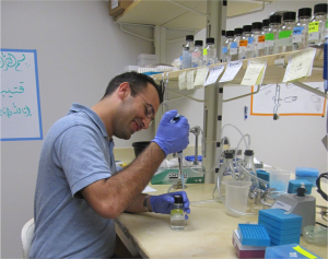 man in lab using pipette